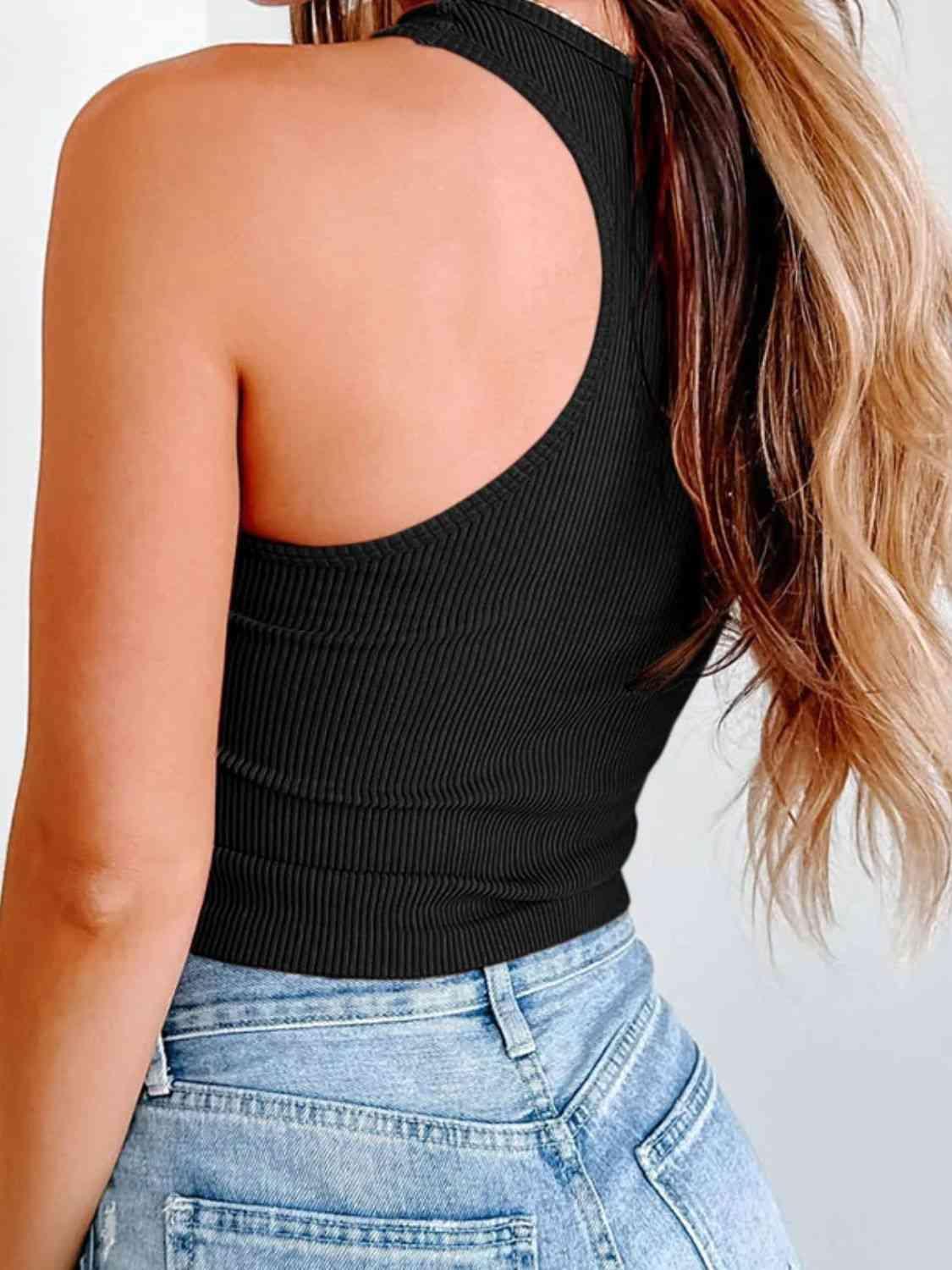 a woman with long hair wearing a black top
