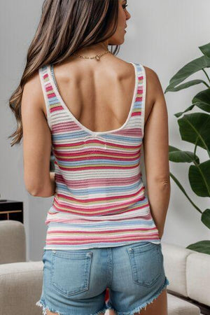 a woman in shorts and a tank top