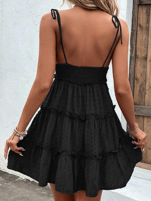 the back of a woman wearing a black dress