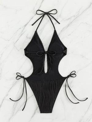 a black bikinisuit with a tie at the back