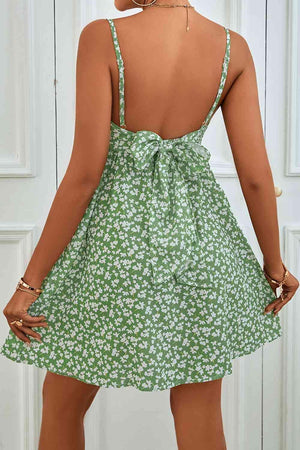 the back of a woman's green dress