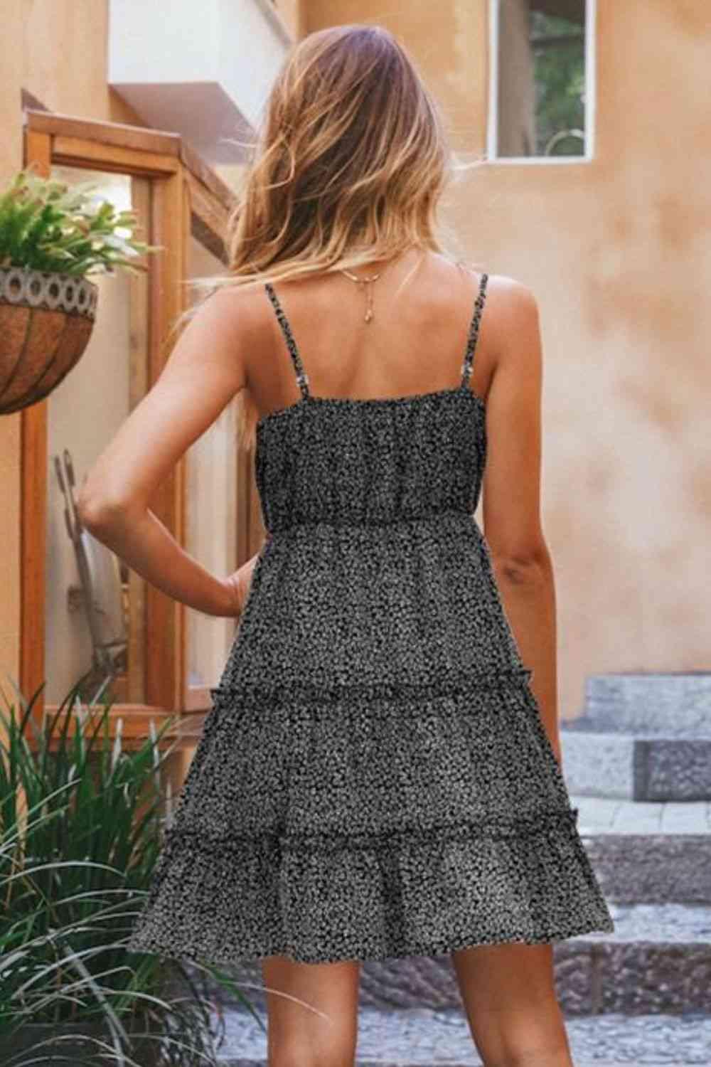 a woman wearing a black and white dress