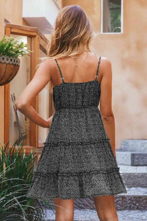 a woman wearing a black and white dress