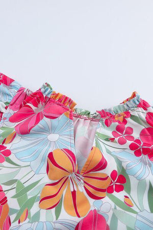 a close up of a dress with flowers on it