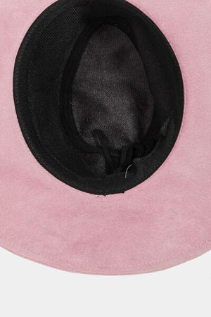 a pink hat with a black brimmed band