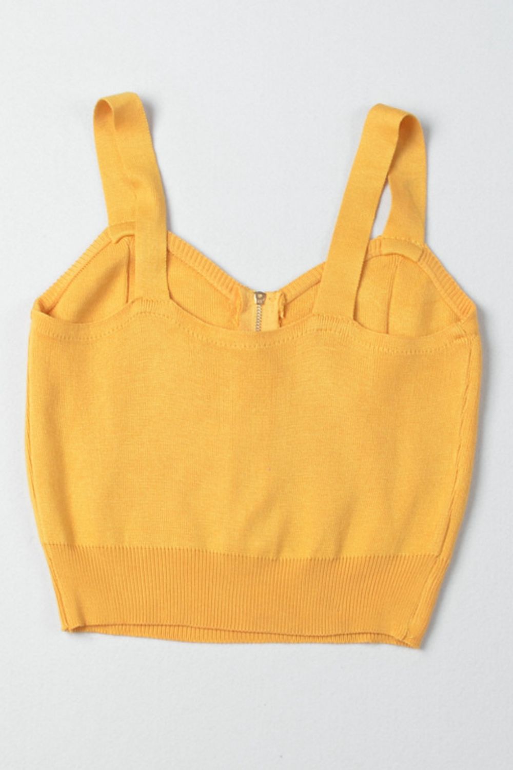 a yellow crop top with straps on the back