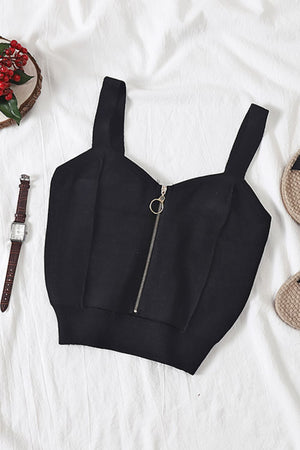 a black crop top with a zipper on it
