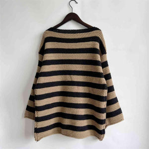 a striped sweater hanging on a hanger