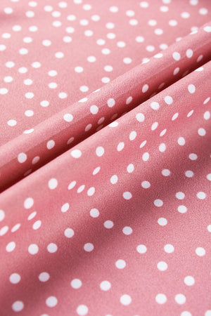 a pink polka dot fabric with white dots