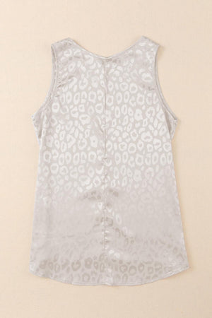 a white top with a leopard print on it