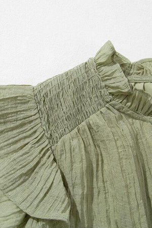 a close up of a dress on a hanger