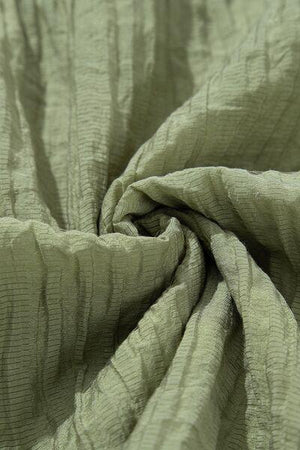 a close up view of a green fabric