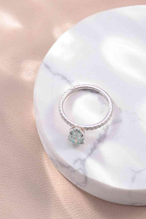 a close up of a ring on a marble surface