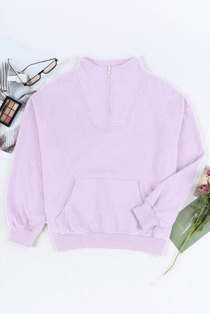 a pink sweatshirt with a flower and a pair of glasses