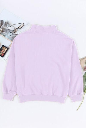 a pink sweatshirt with a picture of a woman on it