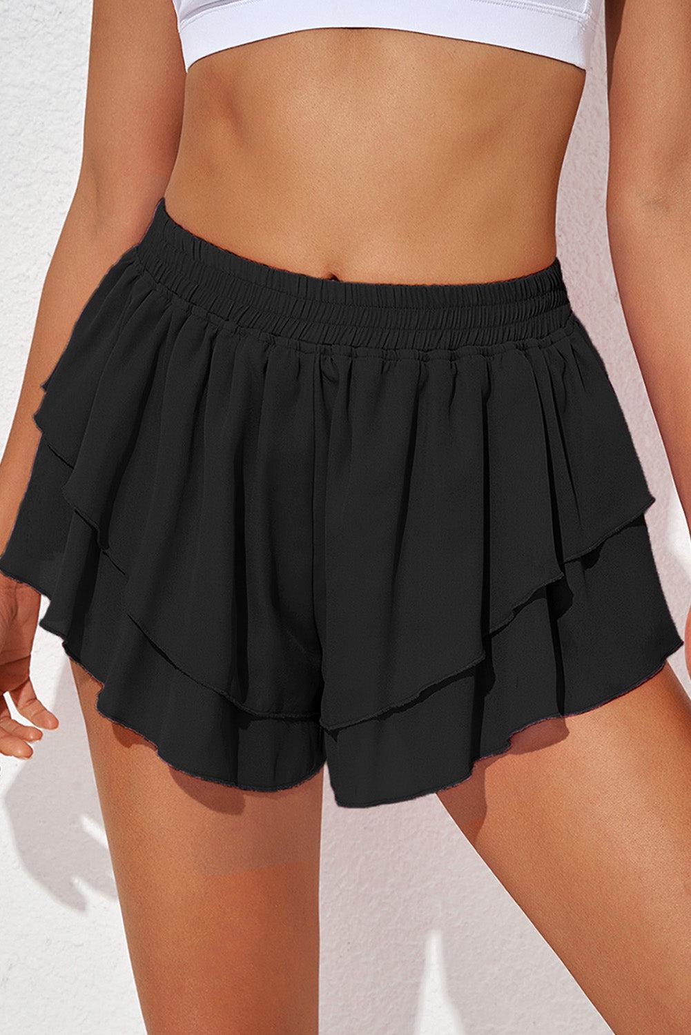 a woman in a white top and black skirt