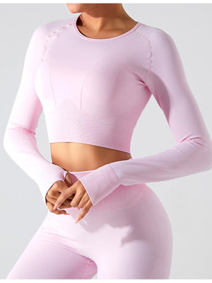 a woman in a pink top and leggings
