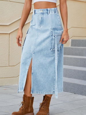 a woman in a white top and a denim skirt