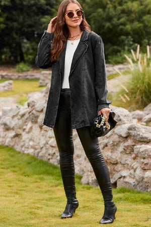 a woman wearing black leather pants and a black jacket