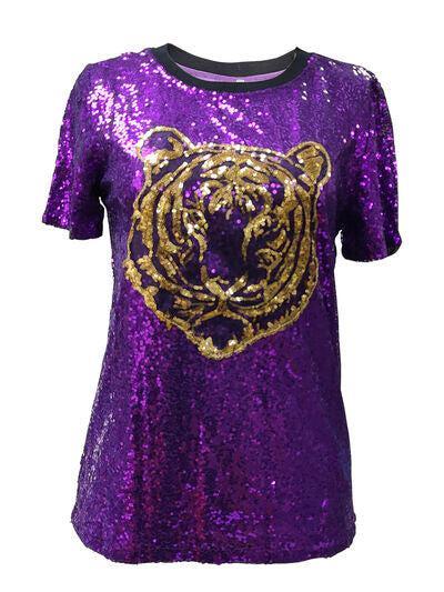 a purple shirt with a gold tiger on it