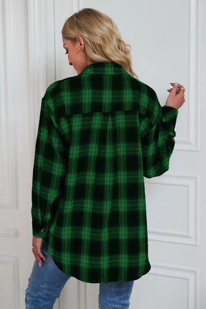 a woman wearing a green and black plaid shirt