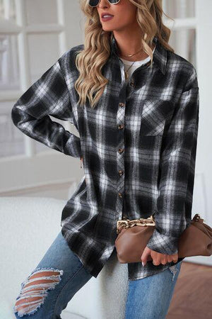 a woman wearing a black and white plaid shirt