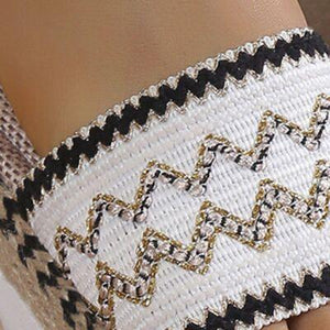 a close up of a person wearing a bracelet