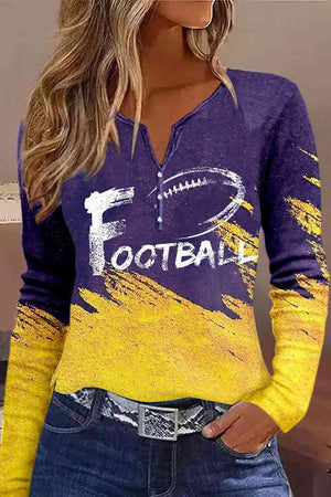 a woman wearing a purple and yellow football shirt