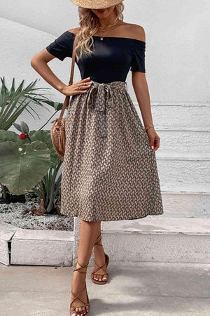 a woman wearing a hat and a dress