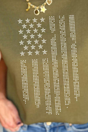 a woman wearing a green shirt with white stars on it