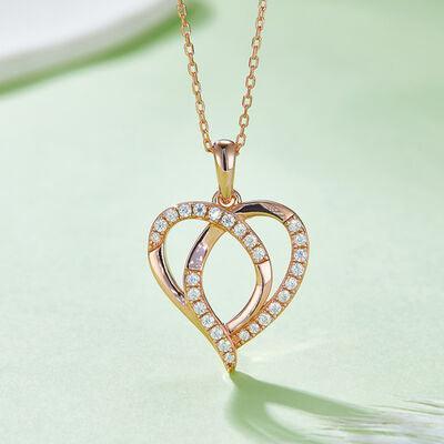 a heart shaped pendant with diamonds on a chain