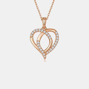 a heart shaped pendant with diamonds on a chain