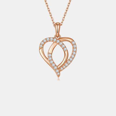 a heart shaped pendant with diamonds on a chain