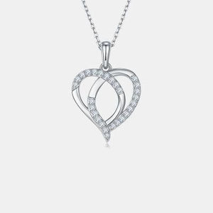 a heart shaped pendant with diamonds on a chain