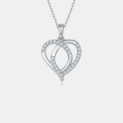 a heart shaped pendant with diamonds on a chain