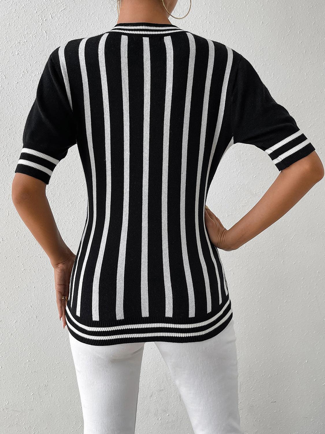 a woman wearing a black and white striped sweater