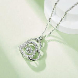 a heart shaped pendant on a chain