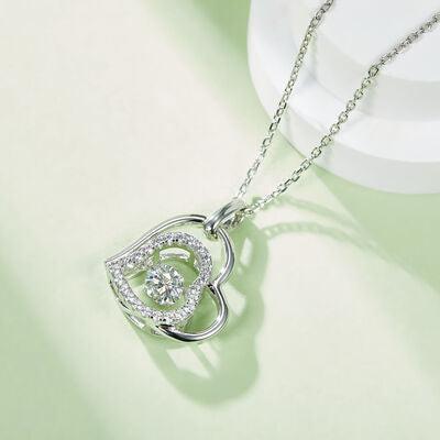 a heart shaped pendant on a chain