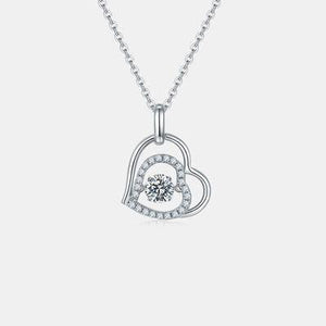 a diamond heart pendant on a chain