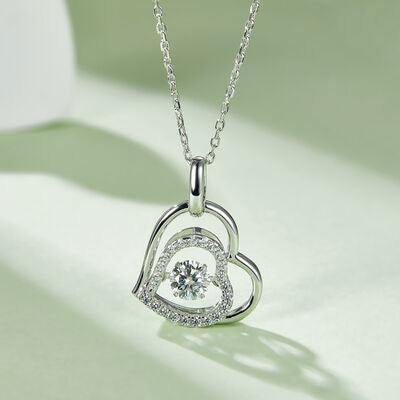 a heart shaped diamond pendant on a chain