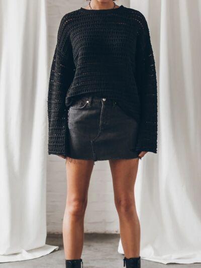 a woman standing in front of a white curtain