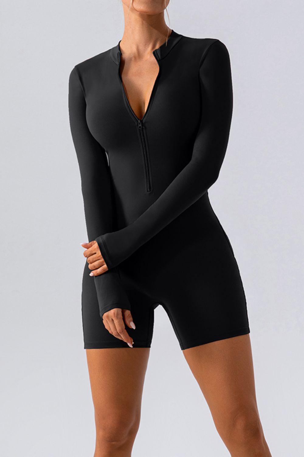 a woman in a black bodysuit posing for the camera