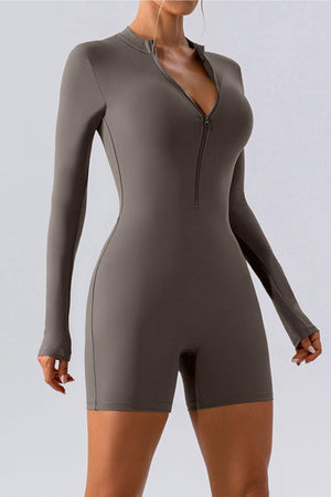 a woman in a bodysuit with a zipper