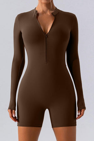a woman wearing a brown bodysuit with long sleeves