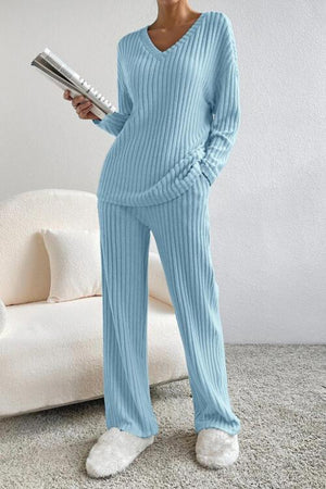 a woman in a blue sweater and matching pants