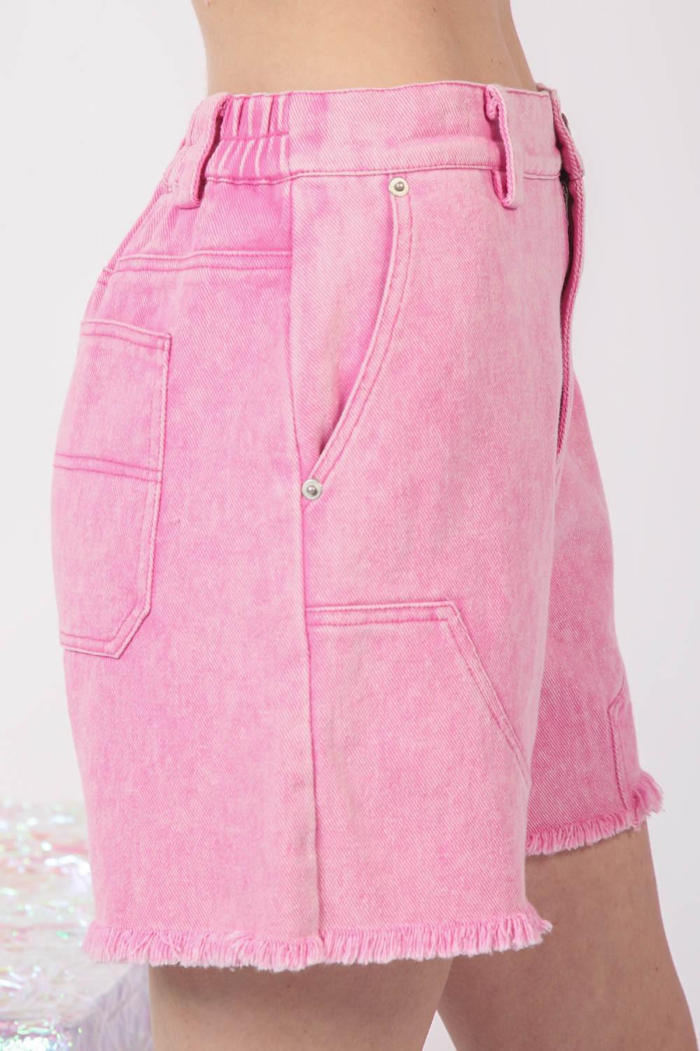 a close up of a person wearing pink shorts