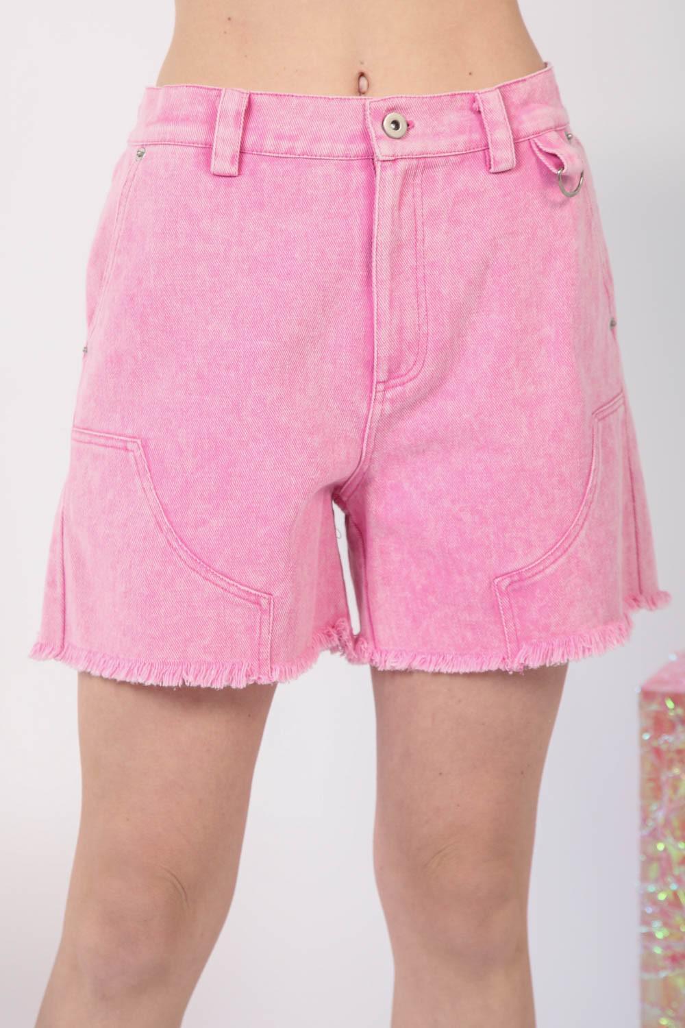 a close up of a person wearing pink shorts