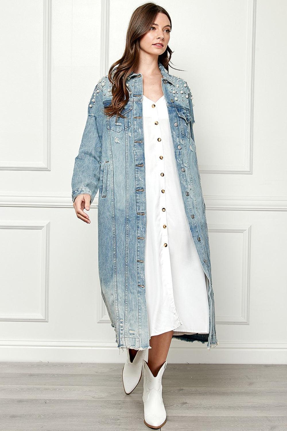 a woman in a white dress and jean jacket