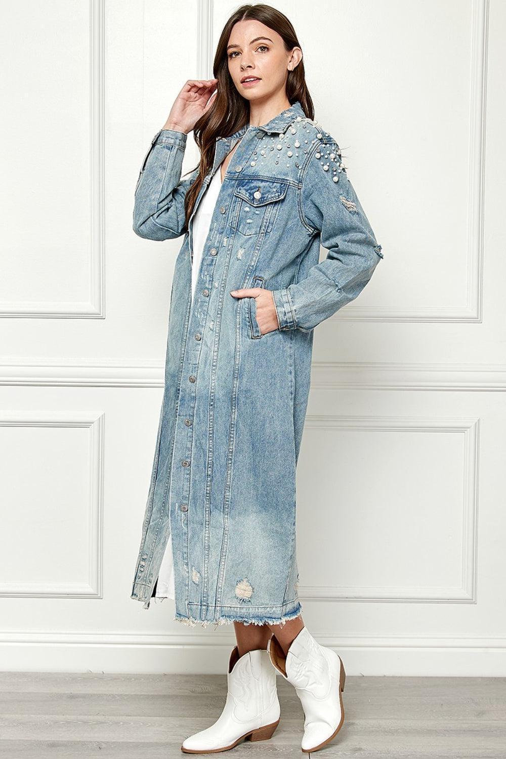 a woman wearing a jean jacket and white boots