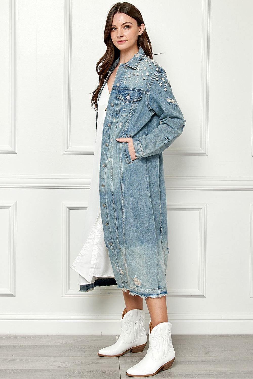 a woman wearing a denim jacket and white boots